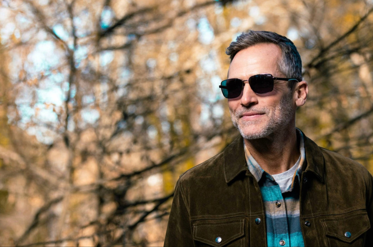 Man in the timber wearing Ducks Unlimited polarized sunglasses